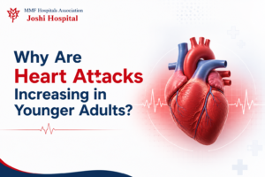 Young adult discussing heart health and heart attack risk factors with a doctor at Joshi Hospital, Pune